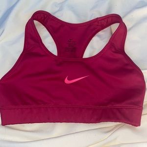 Nike dry fit pink sports bra in size XS. Never worn and in good condition.